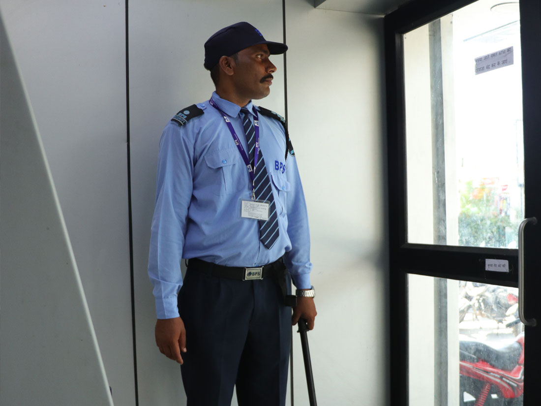 security guard standing in atm